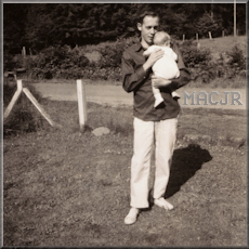 Me, MACJR, in Dad's arms, at my grandparent's house - 1962